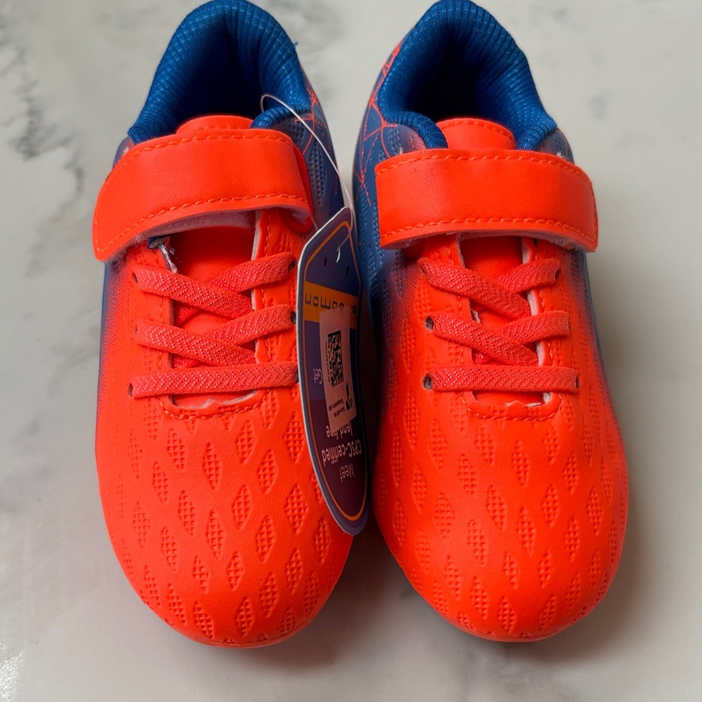 Kids Neon Orange Soccer cleats with Blue Interior